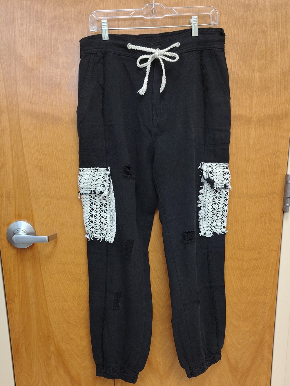 POL Women's Black Distressed Boyfriend Jogger Jeans with White Crochet Pockets